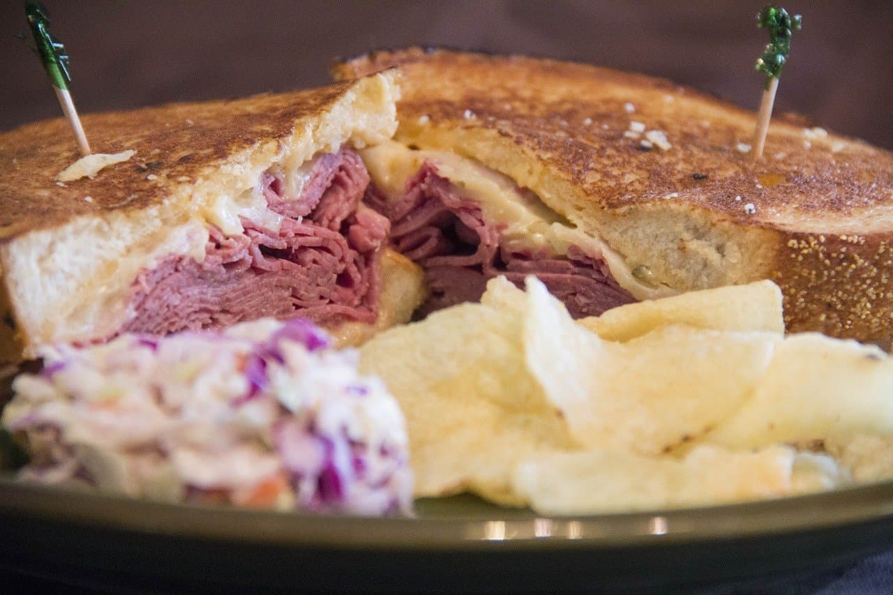 Corned Beef Sandwich with chips and slaw